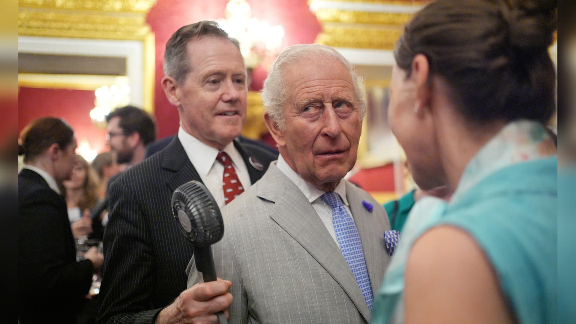 King Charles had to endure the current heat wave in a suit and tie - a small fan provided some cooling.