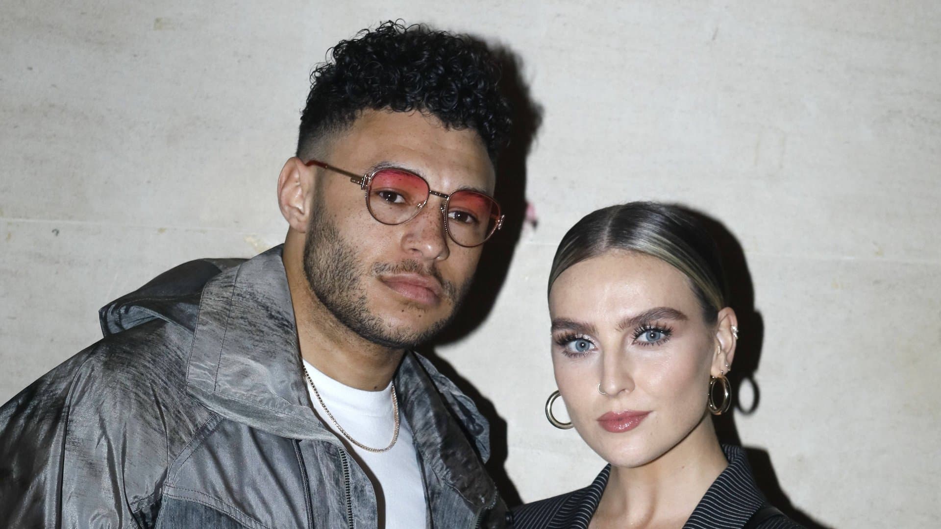 Professional footballer Alex Oxlade-Chamberlain and singer Perrie Edwards have been a couple for around ten years and are already parents of two. Now they have tied the knot.