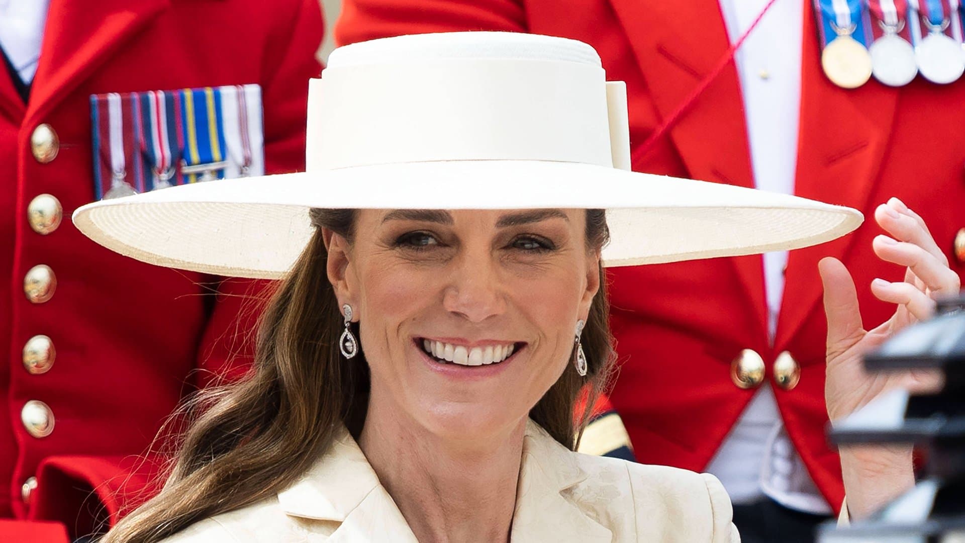 Princess Kate radiated in butter yellow - and with her wedding earrings.