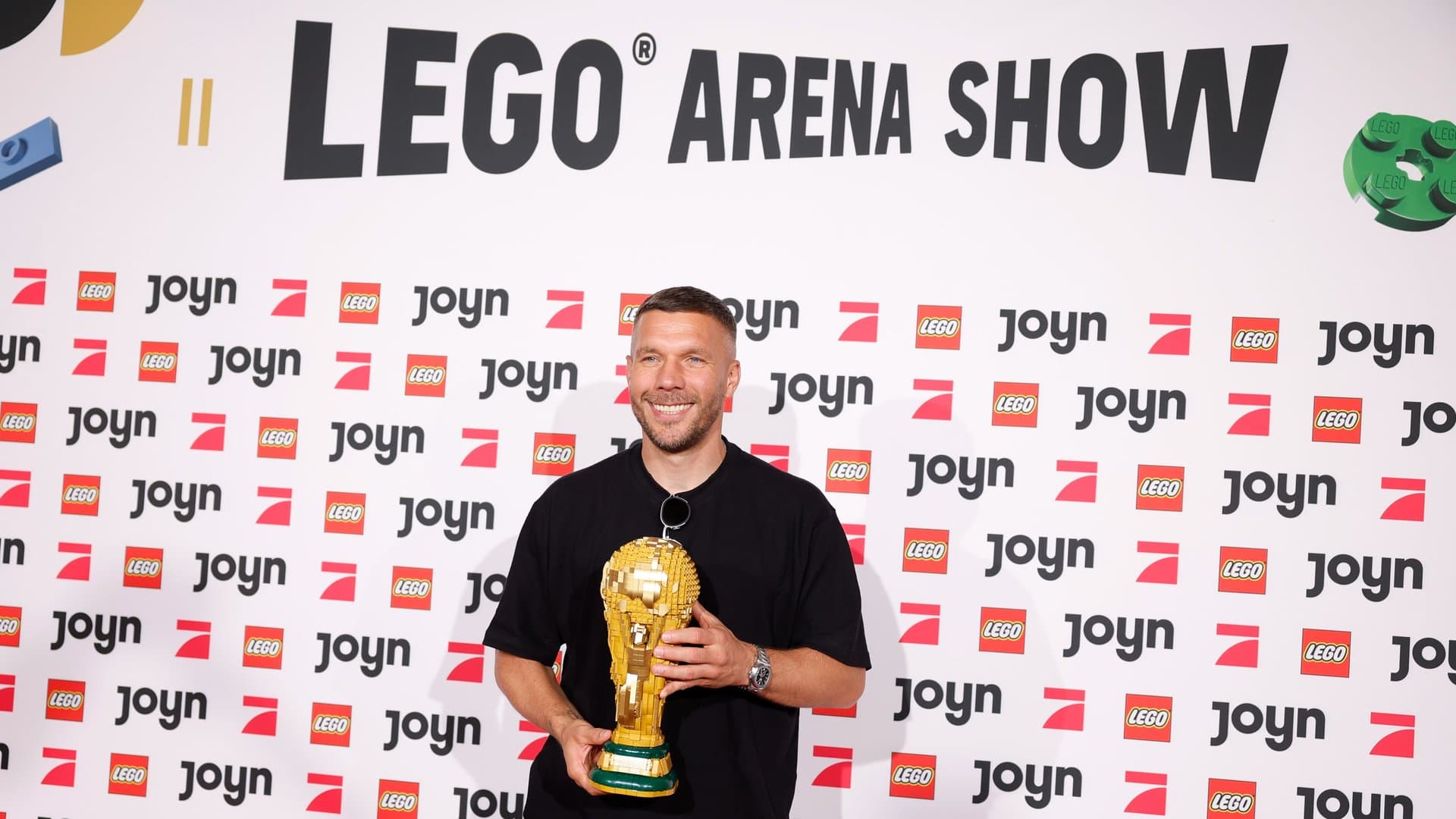 Lukas Podolski with the World Cup trophy made of Lego bricks.