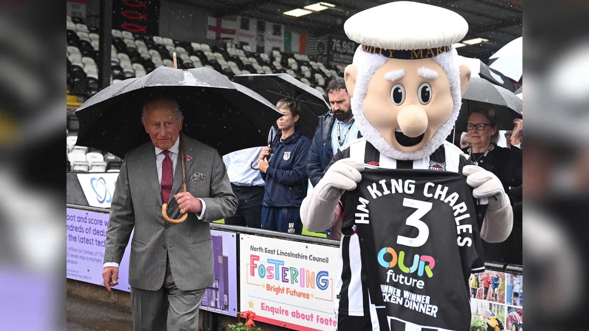 King Charles met the mascot named Mighty Mariner.
