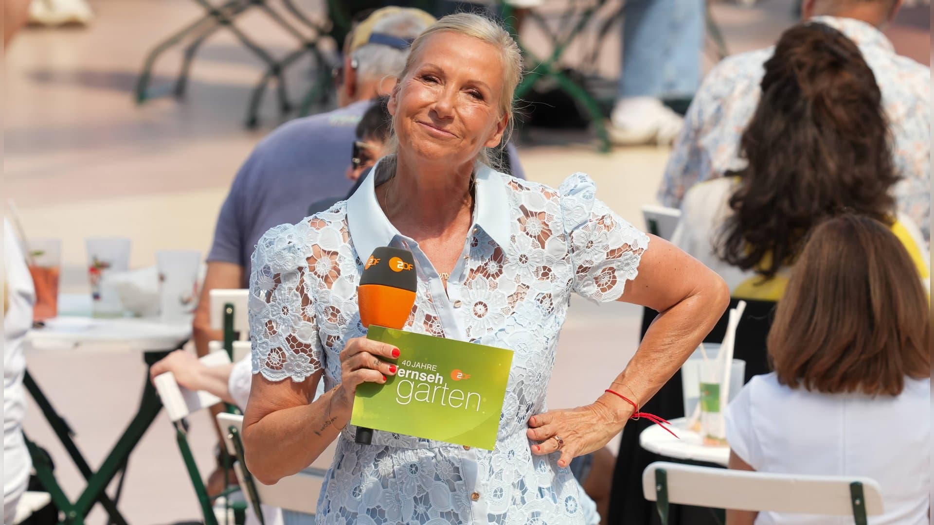 Because she can: Andrea Kiewel spontaneously jumped into the pool on "ZDF-Fernsehgarten."