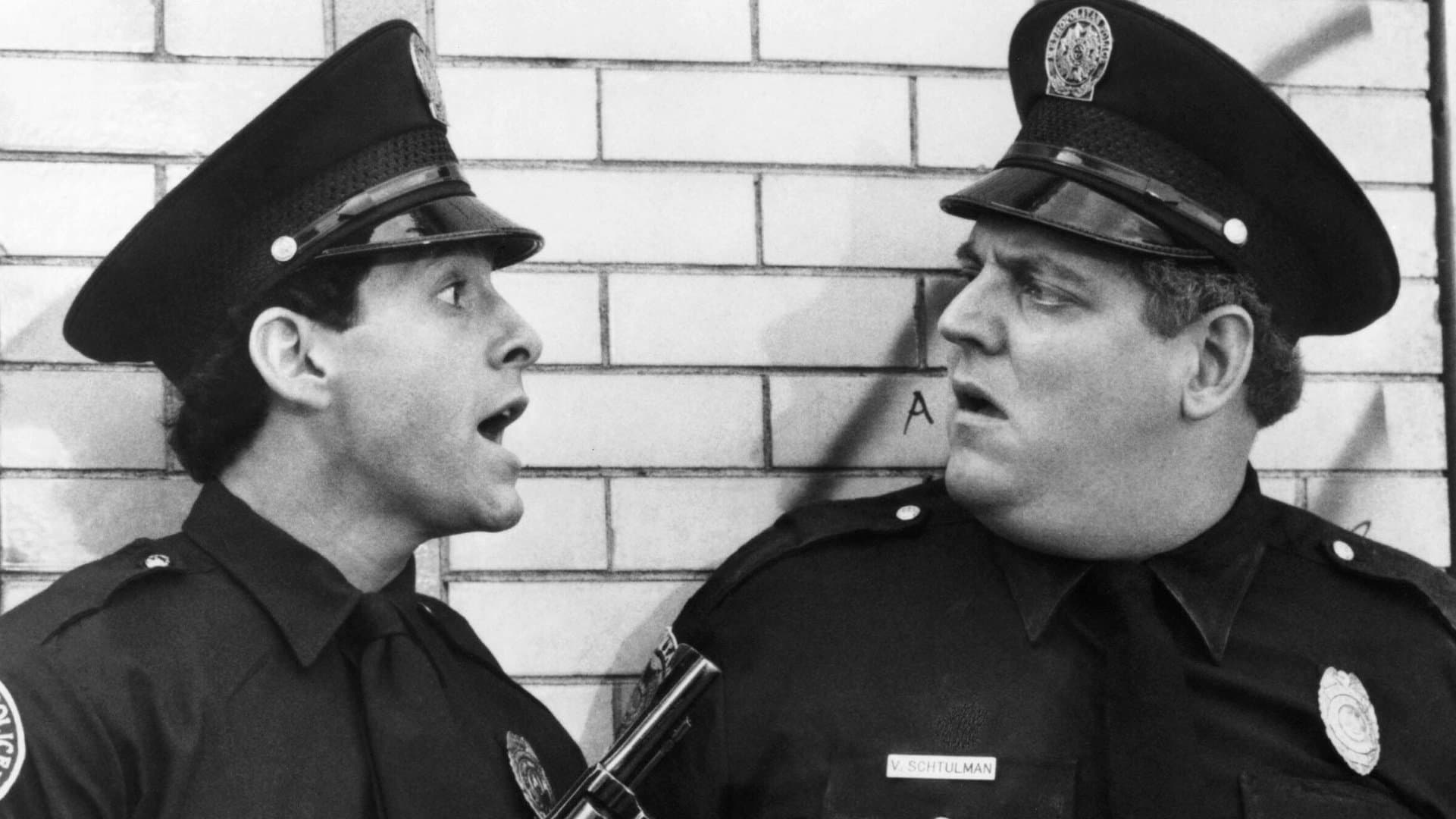 Peter Van Norden (r.) in a scene from "Police Academy 2" with colleague Steve Guttenberg.