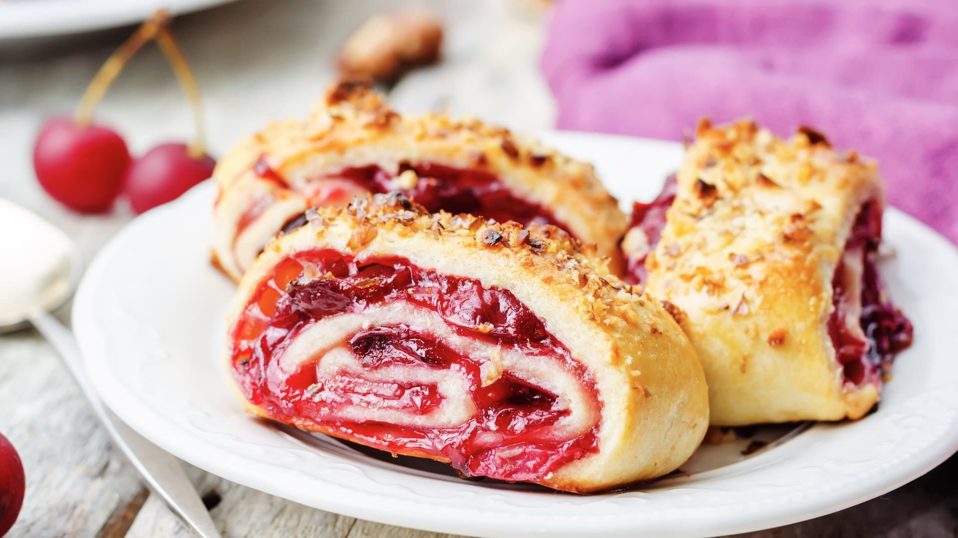 The cherry rolls turn golden brown in the oven.